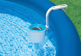 Intex Deluxe Surface Skimmer catching leaves before sinking, reducing cleaning time.