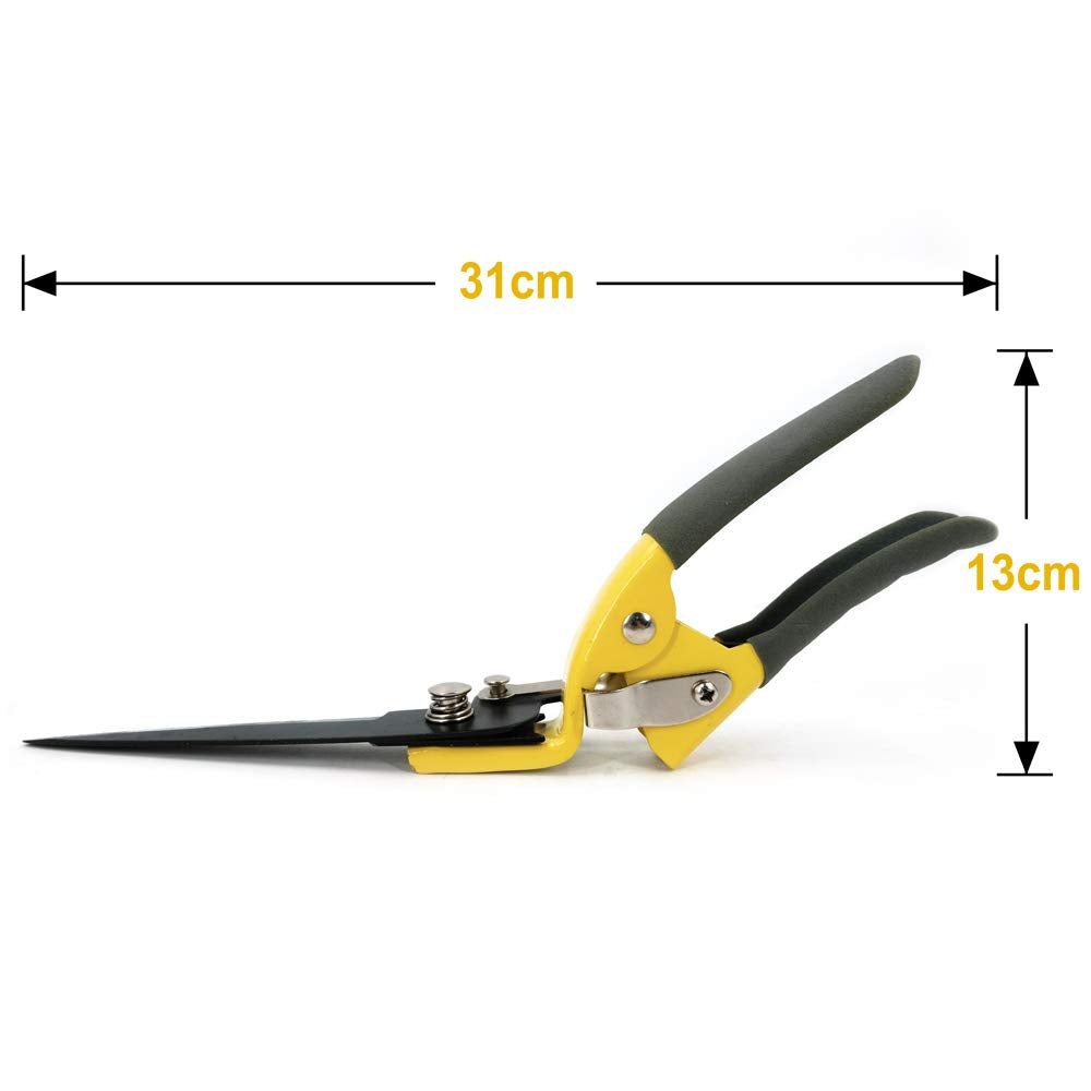 Jardineer grass shears in action edging along a sidewalk.