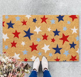 JarThenaAMCS patriotic doormat with red, blue and white stars at the entrance