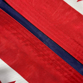 Jayus flag with brass grommets for secure mounting on a pole.