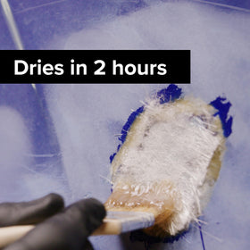 J-B Weld Fiberglass Resin applied on a boat hull crack for repair