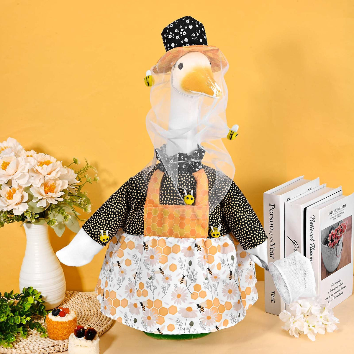 JcHrmers colorful goose outfit brightens garden and patio settings.