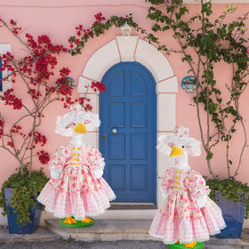 JcHrmers floral porch costume enhances garden display.