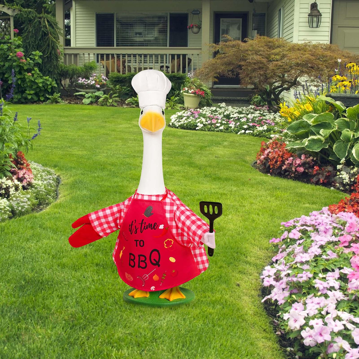 JcHrmers goose chef red gloves provide a vivid finishing touch for yard decor