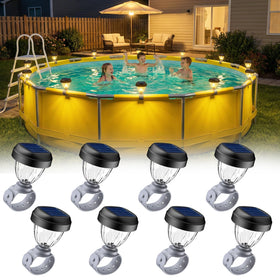 JEMULICE solar pool light at pool edge casts warm white glow for evening ambiance.