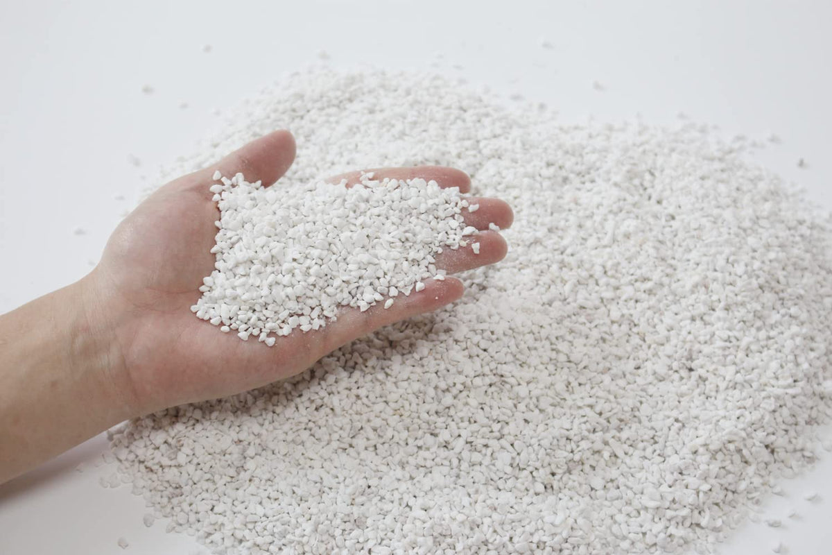 JFWOD Organic Perlite in container garden setup for versatile planting.