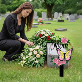 Jiasku MOM letters detail on butterfly, highlighting a heartfelt grave marker.