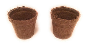 Jiffy-Pots arranged on a windowsill for efficient seed-start setup.