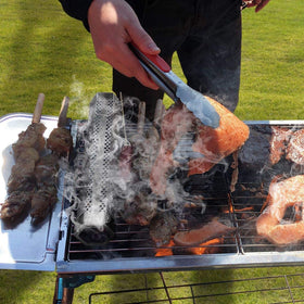 JIIGAAT smoker tube in use for even smoky flavor on any grill