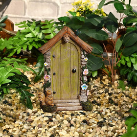 JIUMO fairy door with flower vine and bird accents enhances natural garden appeal.