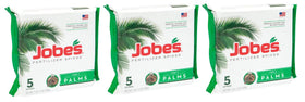 Jobe's Organics palm tree fertilizer spikes inserted at the root zone for steady growth.