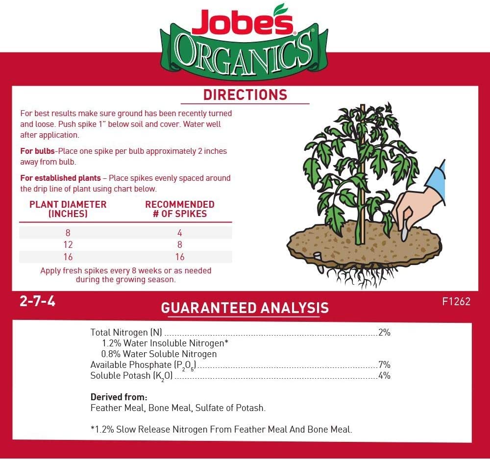Close-up of a Jobe's Organics spike ready to insert into soil
