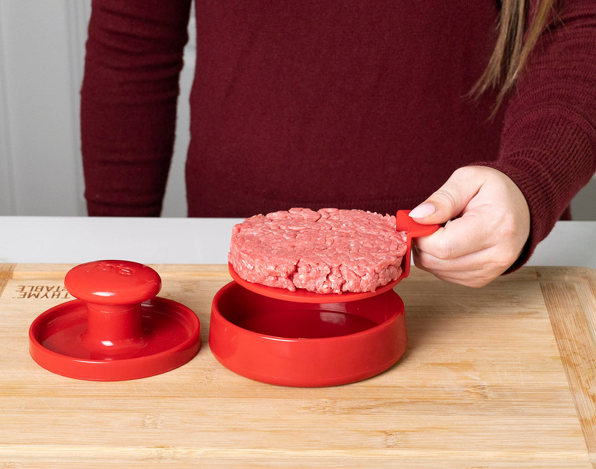 Joie burger press on a top rack for quick dishwasher cleanup.