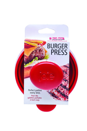 Joie burger press tucked in a drawer highlighting compact design.