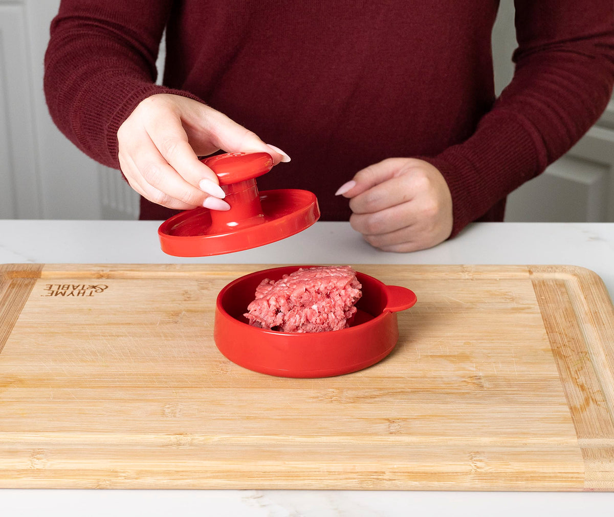 Joie burger press shaping meat and veggie patties for versatile use.