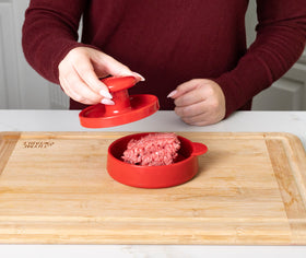 Joie burger press shaping meat and veggie patties for versatile use.