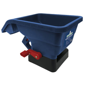 Jonathan Green handheld lawn spreader in use for even seed distribution across a small patch.