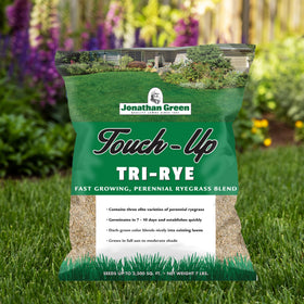 Spread Jonathan Green TRI-RYE seed over bare patches for dense, even turf.