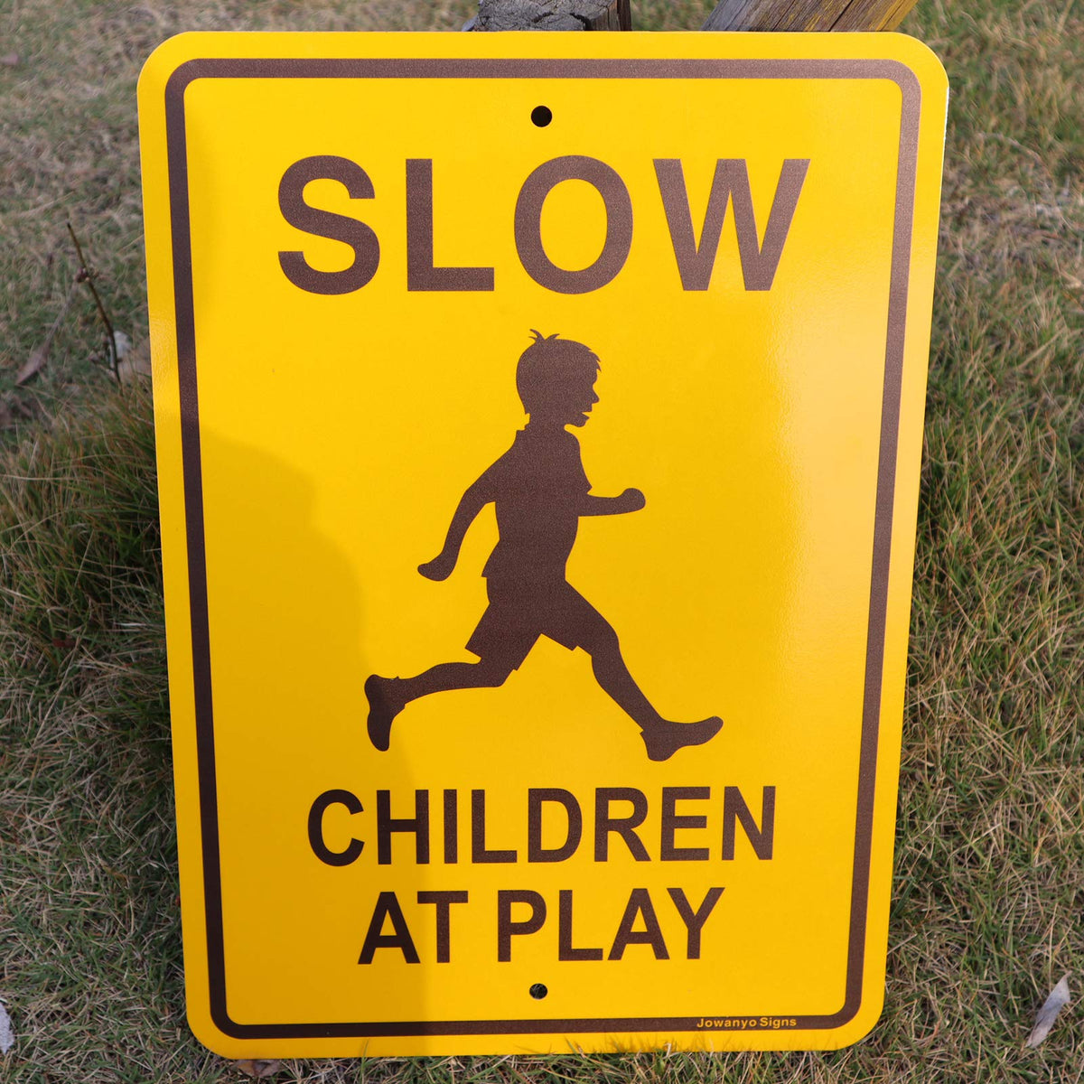 Jowanyo Slow Down Children at Play sign easy-to-mount design ensures quick installation on posts.
