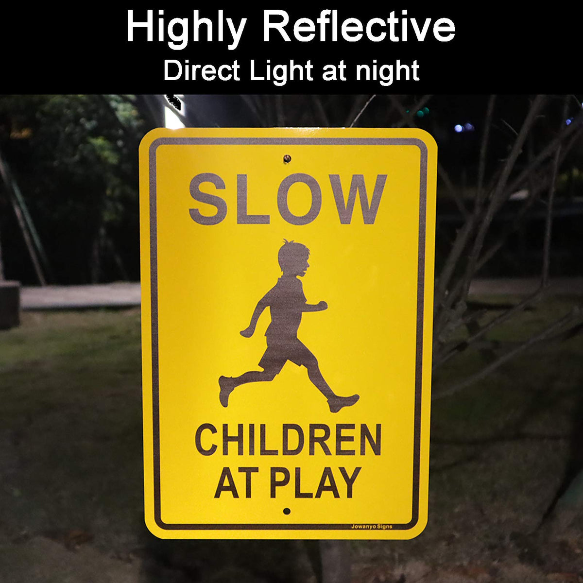 Jowanyo Slow Down Children at Play sign laminated with reflective coating improves visibility from a distance.