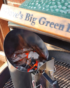 Joyagrill chimney starter in use on grill for even ignition.