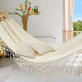 JoyView Boho Macrame Double Hammock invites peaceful lounging under a shaded sky.