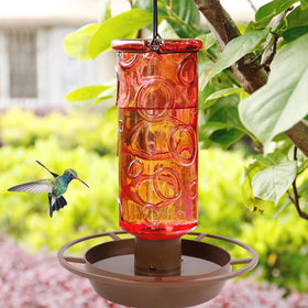 Juegoal red waterer adds decorative charm while inviting thirsty visitors.