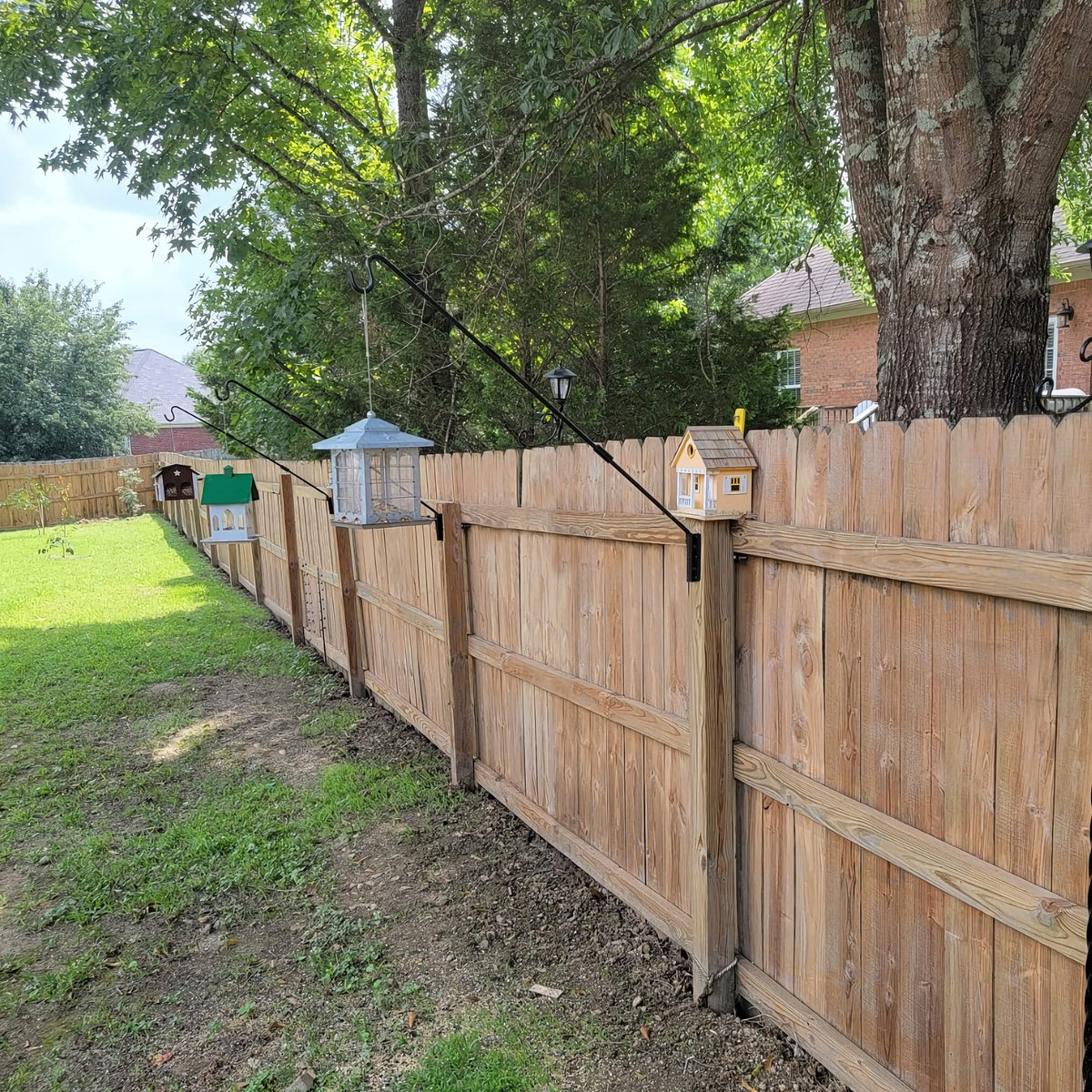 Juegoal suet basket and wind chimes hang securely outdoors.