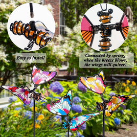 Juegoal fluttering butterfly wings on a stake move with the breeze.