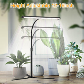 Juhefa grow light desk setup on a work surface with indoor plants nearby