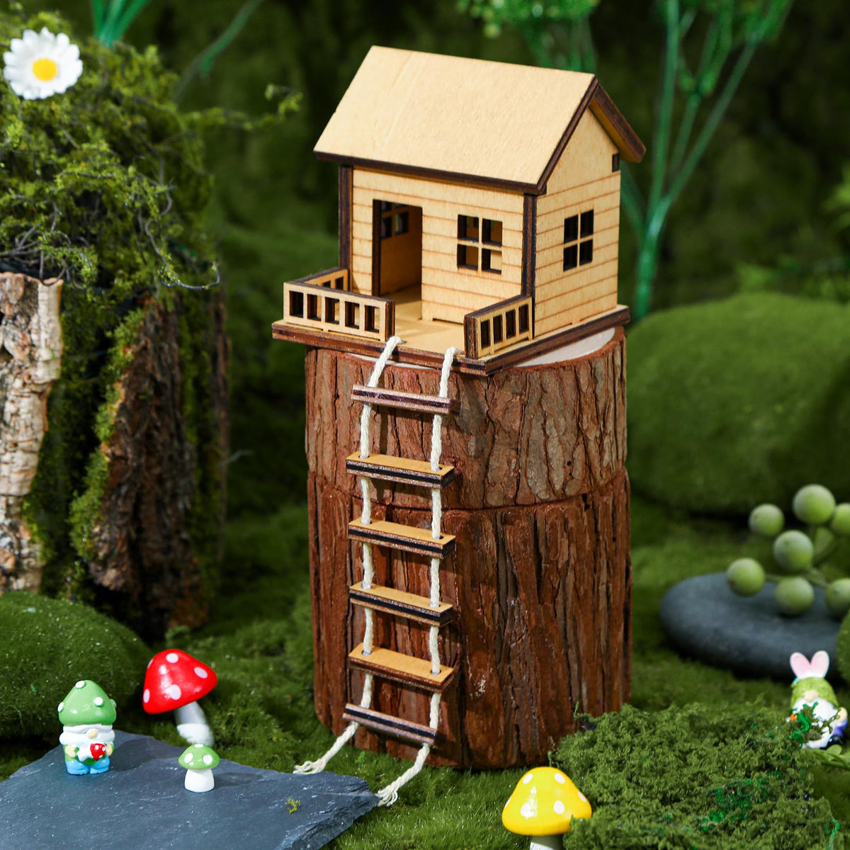 JULEASEL mini-treehouse with ladder beside a plant for whimsy