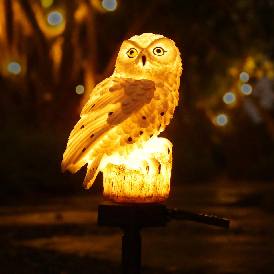 Juliahestia solar owl on pole glows at night, enhancing yard charm