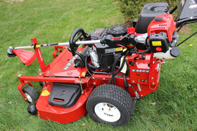 Jungle Jim's Mower Trimmer Rack on a stand-on mower keeps your trimmer ready at hand