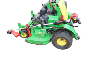 Jungle Jim's Mower Trimmer Rack mounted on a walk-behind mower for secure transport