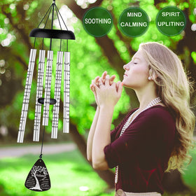 Just For Wind bereavement gift wind chimes hanging on a patio creating a peaceful ambiance