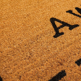Rustic brown tone of Juvale Go Away Doormat enhances curb appeal.
