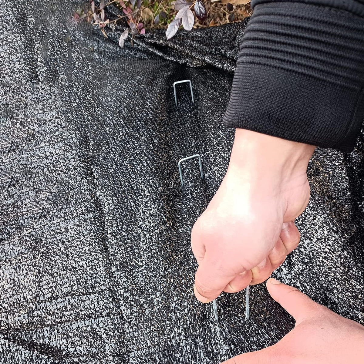 Jxrhy landscape staples securing edging, hoses, and wires outdoors.
