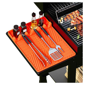 Kaisiking silicone grill mat on the side shelf keeps tools organized within reach.