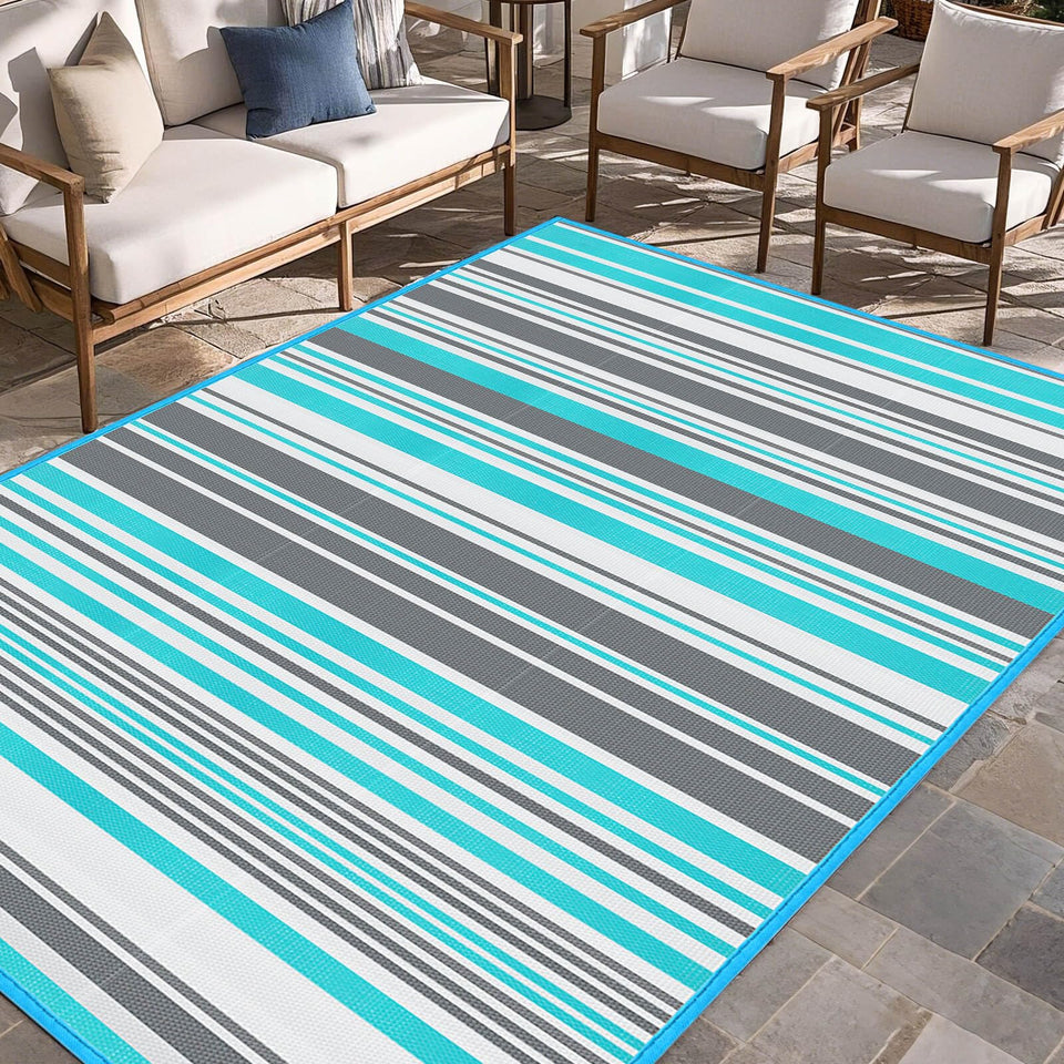 Kalafun outdoor rug with blue and grey stripes on a patio, durable and easy to clean