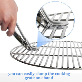 KAMaster grill grate lifter used with two hands for safer handling.