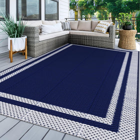 KMAT outdoor rug 5x8 blue-white foldable on patio for easy storage.