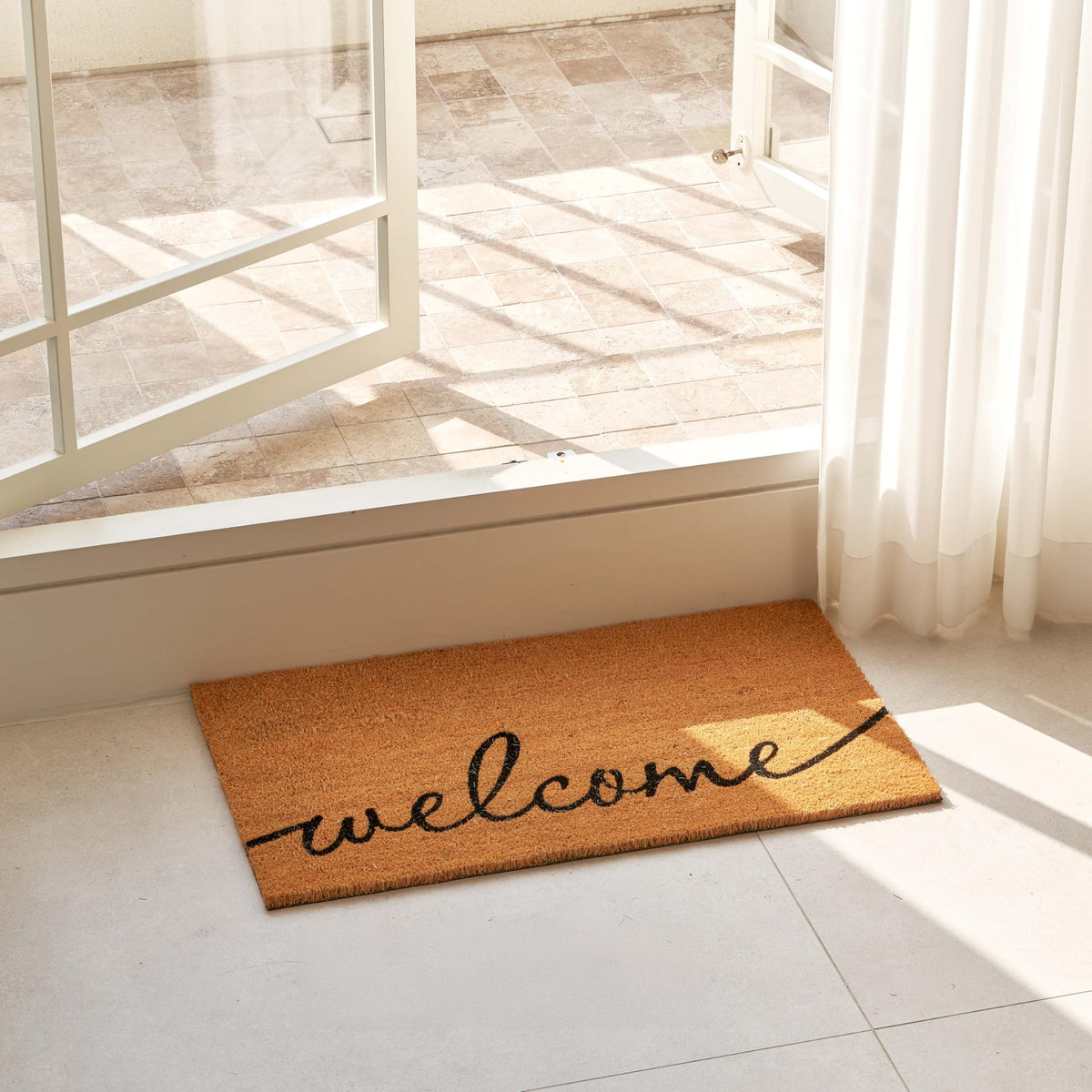 KANKUN welcome door mat shown outdoors highlighting indoor-outdoor versatility