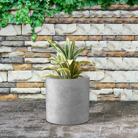 Kante modern cylindrical planter provides a contemporary focal point.