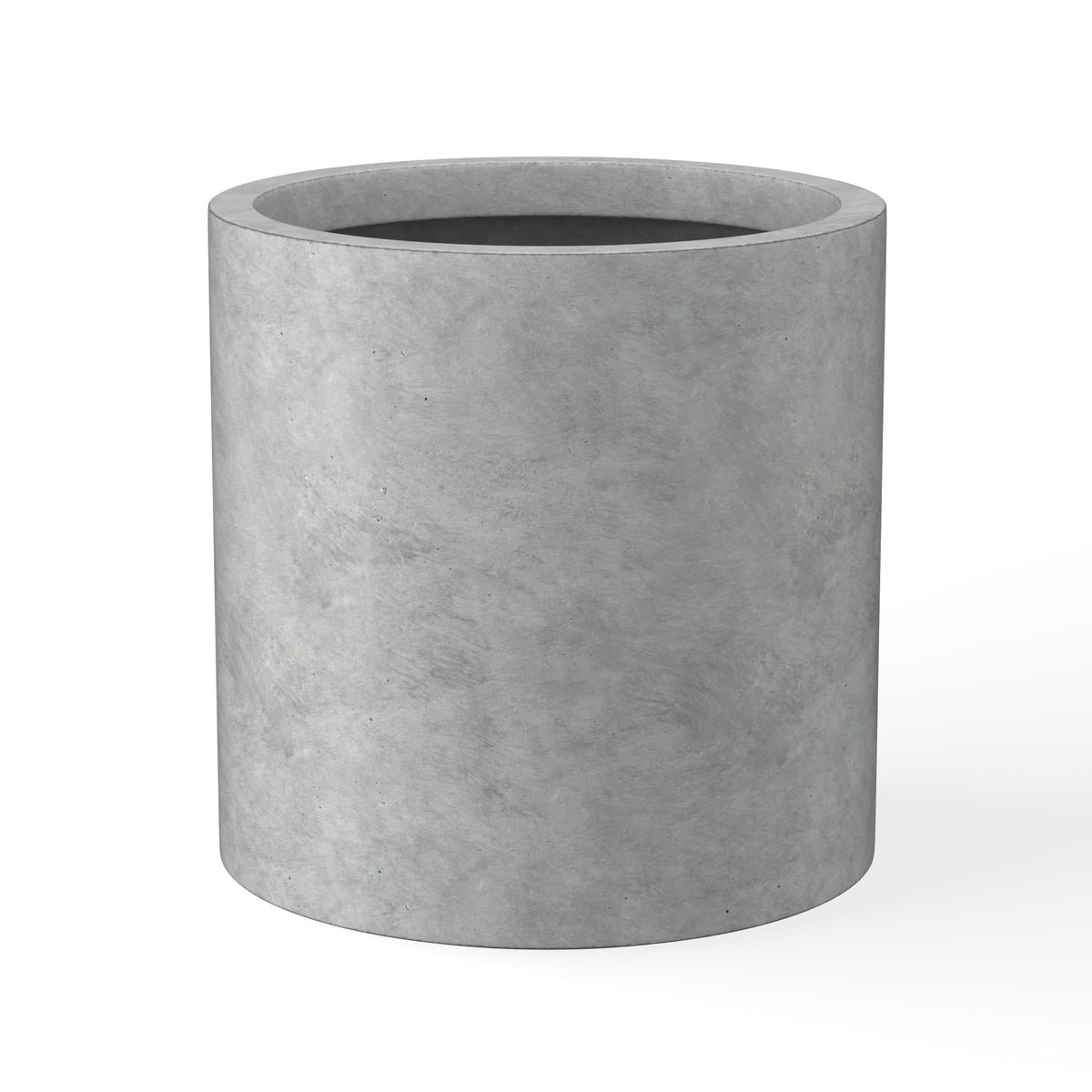 Kante round concrete planter front view showing natural texture for modern interiors.