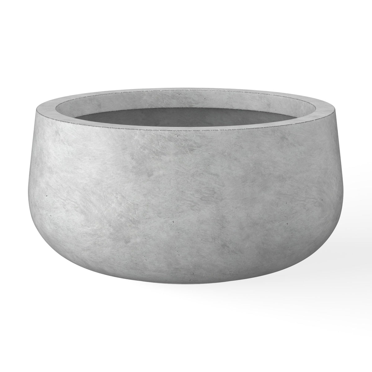 Kante round concrete planter with curved design enhances modern spaces.