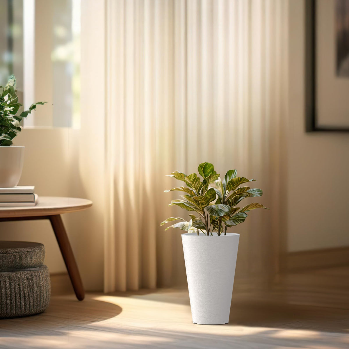 Kante planter with integrated handle enables easy inner pot removal.
