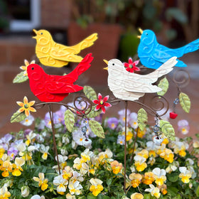 KEDONCHEN four-piece flower stake set adds color and movement to any garden.