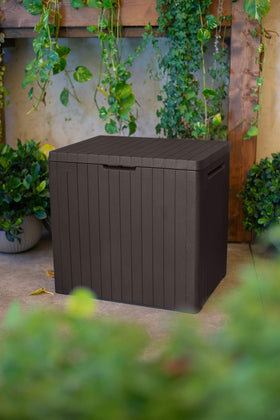 Keter City wood-panelled style storage box adds decorative storage to outdoor spaces.
