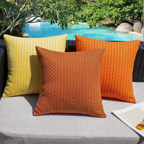 Tent, balcony, and patio setups benefit from Kevin Textile burnt orange outdoor cushions
