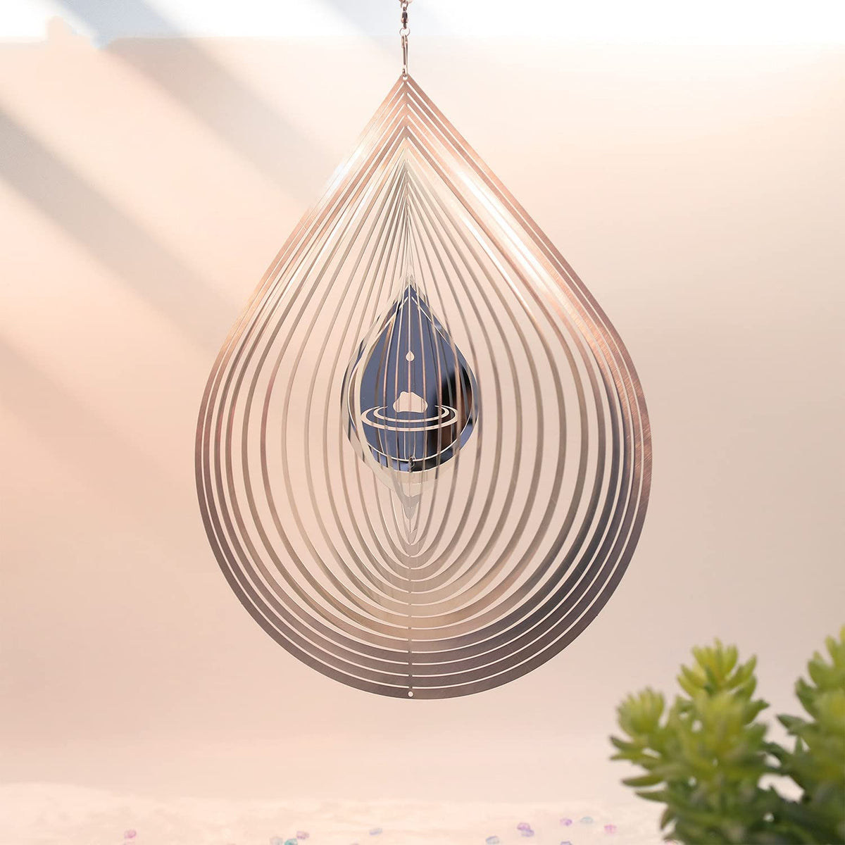 Kexsscai outdoor decor wind spinner deters birds from garden spaces.